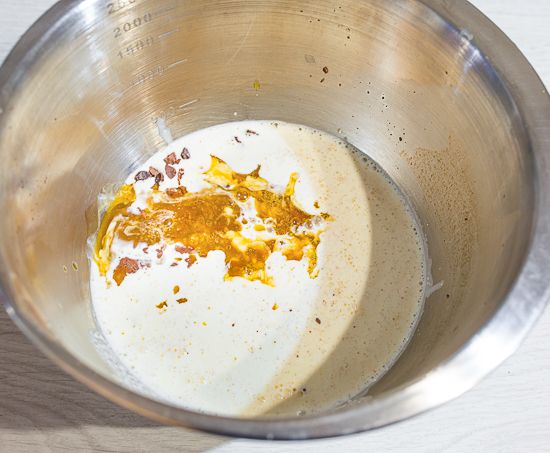 Pour the cream and puree over chocolate